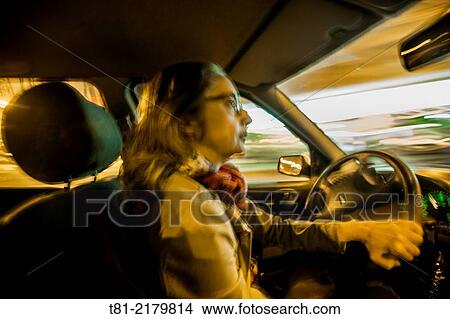 Adult woman driving through Barcelona, Spain View Large Photo Image Picture - Adult woman driving through Barcelona, Spain. Fotosearch