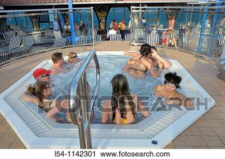 Adults enjoy whirlpool on Caribbean Cruise Ship View Large Photo Image Stock Image - Adults enjoy whirlpool on Caribbean Cruise Ship. Fotosearch