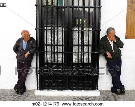 adults resting on a street in the village of Mijas on the Costa del Sol, Andalucia, Spain View Large Photo Image Stock Photo - adults resting on a street in the village of Mijas on the Costa del Sol, Andalucia, Spain. Fotosearch