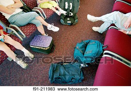Adults traveling with children waiting in airport View Large Photo Image Stock Image - Adults traveling with children waiting in airport. Fotosearch