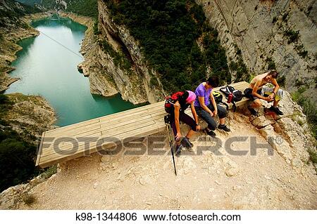 Adventure sports, Mont-Rebei Canyon, Canyelles Reservoir in background, Huesca-Lerida provinces, Catalonia-Aragon, Spain View Large Photo Image Stock Photograph - Adventure sports, Mont-Rebei Canyon, Canyelles Reservoir in background, Huesca-Lerida provinces, Catalonia-Aragon, Spain. Fotosearch