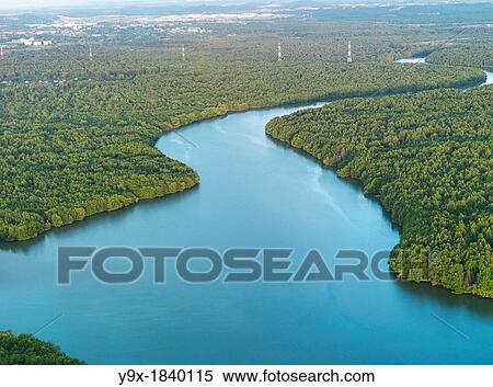 Aerial image of a bright blue tributary through the Johor jungle View Large Photo Image Stock Photography - Aerial image of a bright blue tributary through the Johor jungle. Fotosearch