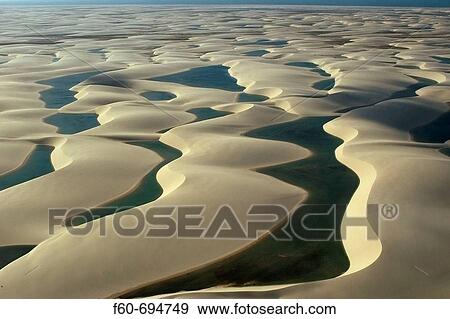 Aerial image of rain ponds in between sand dunes, Lencois Maranhenses, Maranhao, Brazil View Large Photo Image Stock Photo - Aerial image of rain ponds in between sand dunes, Lencois Maranhenses, Maranhao, Brazil. Fotosearch
