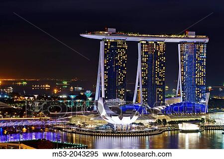 Aerial night view of Marina Bay Sand, a luxury complex that include hotel, casino, exhibition centre and a shopping mall. Singapore. View Large Photo Image Stock Photography - Aerial night view of Marina Bay Sand, a luxury complex that include hotel, casino, exhibition centre and a shopping mall. Singapore.. Fotosearch