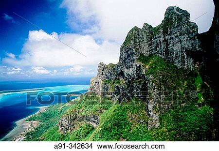 Aerial of the Otemanu peak in Bora-Bora. Leeward islands. Society archipelago. French Polynesia View Large Photo Image Picture - Aerial of the Otemanu peak in Bora-Bora. Leeward islands. Society archipelago. French Polynesia. Fotosearch