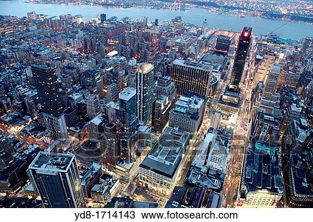 Stock Image - Aerial view at sunset from the Empire State Building in New York, NY, USA. Fotosearch