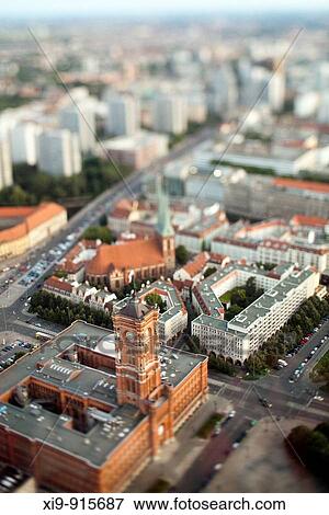 Aerial view from the TV Tower of the City Hall and Nikolaikirche focus on the City Hall, Berlin, Germany Tilted lens used for a shallower depth of field and to create, combined with the aerial view, a miniaturization effect View Large Photo Image Stock Photo - Aerial view from the TV Tower of the City Hall and Nikolaikirche focus on the City Hall, Berlin, Germany Tilted lens used for a shallower depth of field and to create, combined with the aerial view, a miniaturization effect. Fotosearch