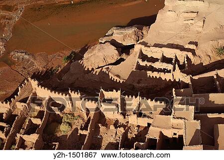 Aerial view of a kashbah fortified mud village near Ksar of Ait-Ben-Haddou, Morocco View Large Photo Image Stock Photo - Aerial view of a kashbah fortified mud village near Ksar of Ait-Ben-Haddou, Morocco. Fotosearch