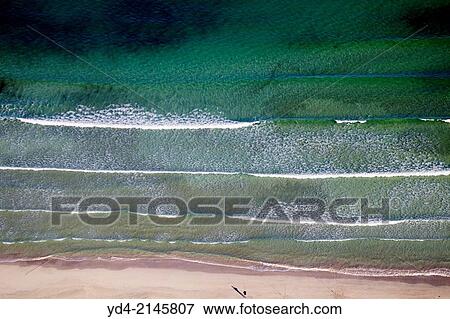 Aerial view of Alcudia Beaches. A person fishing on the coast, Alcudia Bay, Mallorca, Balearic Island, Spain. View Large Photo Image Stock Photo - Aerial view of Alcudia Beaches. A person fishing on the coast, Alcudia Bay, Mallorca, Balearic Island, Spain.. Fotosearch