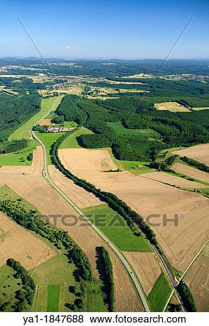 Aerial view of Heiligenbronn farm and forest on road between Enchenberg and Gros Rederching, Moselle, Lorraine, France - Natural regional park of Northern Vosges View Large Photo Image Stock Photo - Aerial view of Heiligenbronn farm and forest on road between Enchenberg and Gros Rederching, Moselle, Lorraine, France - Natural regional park of Northern Vosges. Fotosearch