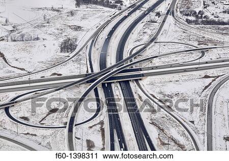Aerial view of highway intersection in the snowy winter, Toronto, Ontario, Canada. View Large Photo Image Stock Image - Aerial view of highway intersection in the snowy winter, Toronto, Ontario, Canada.. Fotosearch
