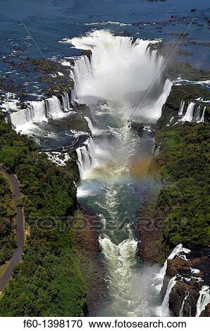 Aerial view of Iguassu Falls and rainbow, Iguassu river, border between Brazil and Argentina. View Large Photo Image Stock Image - Aerial view of Iguassu Falls and rainbow, Iguassu river, border between Brazil and Argentina.. Fotosearch