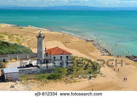 Aerial view of lighthouse of Bibione. In the background the coast of Friuli. View Large Photo Image Picture - Aerial view of lighthouse of Bibione. In the background the coast of Friuli.. Fotosearch