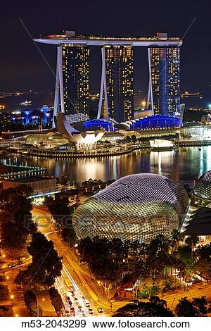 Aerial view of Marina Bay at night. In foreground The Esplanade theatre while in the background the tall towers of Marina Bay Sands. Singapore. View Large Photo Image Stock Photo - Aerial view of Marina Bay at night. In foreground The Esplanade theatre while in the background the tall towers of Marina Bay Sands. Singapore.. Fotosearch