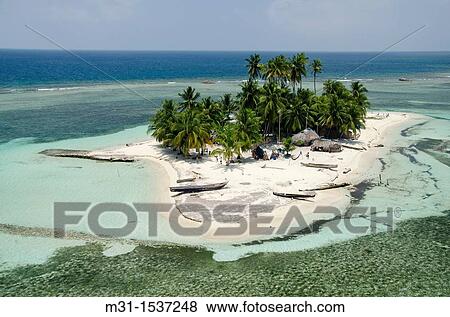 Aerial view of thatched houses and palm tree forest in island San Blas archipelago, Caribbean, Panama, Central America View Large Photo Image Stock Photo - Aerial view of thatched houses and palm tree forest in island San Blas archipelago, Caribbean, Panama, Central America. Fotosearch
