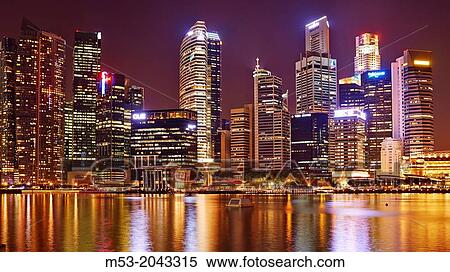 aerial view of the Central Business District by night. In the foreground the water of Marina bay. Singapore. View Large Photo Image Stock Photography - aerial view of the Central Business District by night. In the foreground the water of Marina bay. Singapore.. Fotosearch