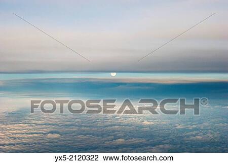 Aerial view of the moon and clouds from an airplane. View Large Photo Image Stock Image - Aerial view of the moon and clouds from an airplane.. Fotosearch
