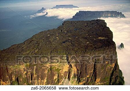 Aerial view of the northern section of Cukenan-Tepuy with Yuruani-tepuy and Ilu-tepuy in the background. Canaima National Park, Bolivar State, Southern Venezuela. View Large Photo Image Stock Photo - Aerial view of the northern section of Cukenan-Tepuy with Yuruani-tepuy and Ilu-tepuy in the background. Canaima National Park, Bolivar State, Southern Venezuela.. Fotosearch