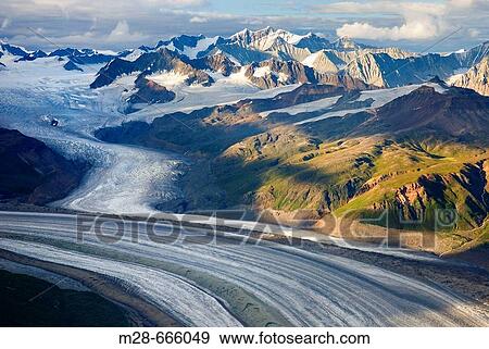 Stock Photo - Aerial view of the Rohn Glacier flowing out of the Wrangell Mountains, Wrangell-St. Elias National Park, Alaska, USA. Fotosearch