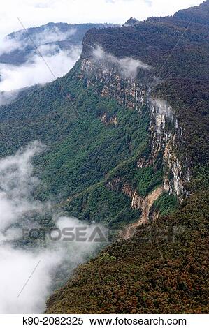 Aerial view of the thick rainforest at the mountain range with fog, Highlands, Papua, Indonesia, Southeast Asia. View Large Photo Image Stock Photography - Aerial view of the thick rainforest at the mountain range with fog, Highlands, Papua, Indonesia, Southeast Asia.. Fotosearch