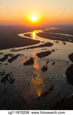 Aerial view of the Zambezi river with riverboats View Large Photo Image Stock Photo - Aerial view of the Zambezi river with riverboats. Fotosearch