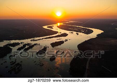 Aerial view of the Zambezi river with riverboats View Large Photo Image Stock Photo - Aerial view of the Zambezi river with riverboats. Fotosearch