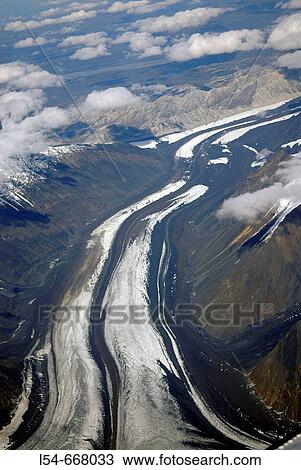 Stock Image - Aerial Views of Mt McKinley Denali National Park Alaska AK U S United States snow covered mountains glaciers icefields. Fotosearch