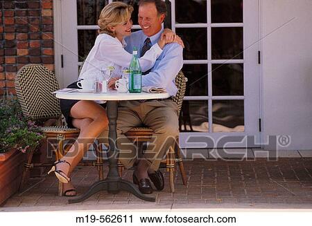 affectionate couple at a cafe View Large Photo Image Stock Image - affectionate couple at a cafe. Fotosearch