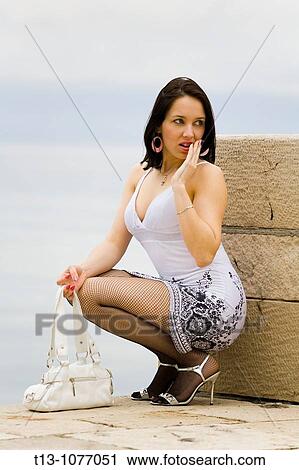 Stock Image - Afraid young woman. Fotosearch