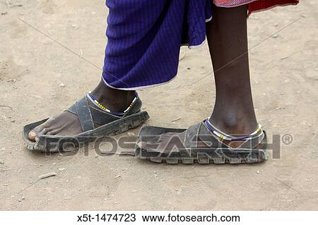 Africa, Tanzania, Maasai tribe an ethnic group of semi-nomadic people Sandals made from used tyres View Large Photo Image Stock Image - Africa, Tanzania, Maasai tribe an ethnic group of semi-nomadic people Sandals made from used tyres. Fotosearch