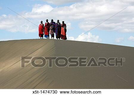 Africa, Tanzania, Maasai tribe an ethnic group of semi-nomadic people a group of tribesmen on a sand dune View Large Photo Image Stock Image - Africa, Tanzania, Maasai tribe an ethnic group of semi-nomadic people a group of tribesmen on a sand dune. Fotosearch