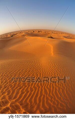 Africa, Tunisia, nr Ksar Rhilane Sunrise over Ksar Ghilane in the sand dunes on the eastern edge of the Grand Erg Oriental in the Sahara desert View Large Photo Image Stock Photo - Africa, Tunisia, nr Ksar Rhilane Sunrise over Ksar Ghilane in the sand dunes on the eastern edge of the Grand Erg Oriental in the Sahara desert. Fotosearch
