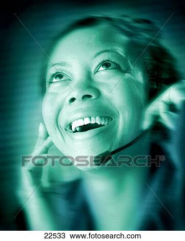 Stock Image - African-American black female telemarketer service person portrait. Fotosearch