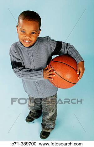 African-American boy holding basketball View Large Photo Image Stock Image - African-American boy holding basketball. Fotosearch