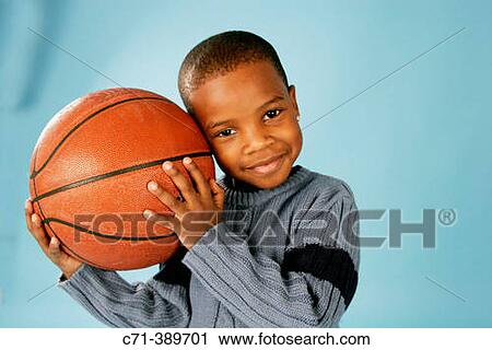 African-American boy holding basketball View Large Photo Image Stock Image - African-American boy holding basketball. Fotosearch