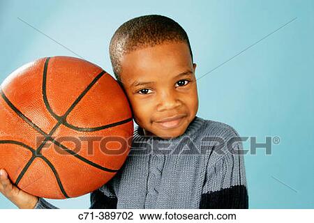 African-American boy holding basketball View Large Photo Image Stock Image - African-American boy holding basketball. Fotosearch