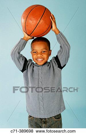 African-American boy holding basketball View Large Photo Image Stock Photo - African-American boy holding basketball. Fotosearch