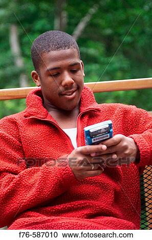 African American boy playing with hand held computer game, View Large Photo Image Stock Image - African American boy playing with hand held computer game,. Fotosearch