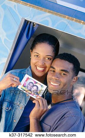 African american couple at photo booth in fun fair View Large Photo Image Stock Image - African american couple at photo booth in fun fair. Fotosearch