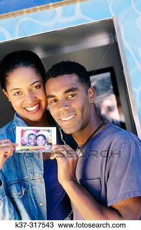 African american couple at photo booth in fun fair View Large Photo Image Stock Image - African american couple at photo booth in fun fair. Fotosearch