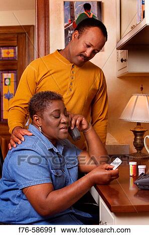 African American Couple discussing medications, calling in for prescription refill. View Large Photo Image Stock Image - African American Couple discussing medications, calling in for prescription refill.. Fotosearch
