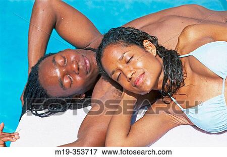 African American couple sun bathing View Large Photo Image Stock Photo - African American couple sun bathing. Fotosearch
