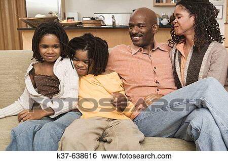 African American family at home sitting in livingroom. View Large Photo Image Stock Photograph - African American family at home sitting in livingroom.. Fotosearch