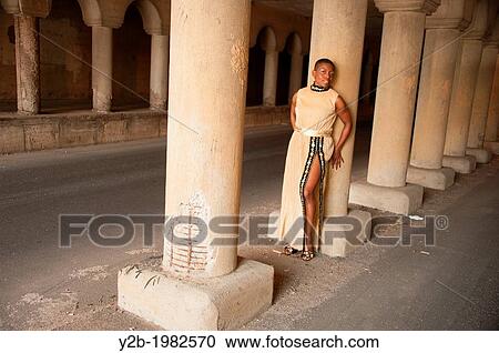 African American female model wearing tan dress standing by columns of automobile tunnel in urban Memphis Tennessee USA. View Large Photo Image Stock Image - African American female model wearing tan dress standing by columns of automobile tunnel in urban Memphis Tennessee USA.. Fotosearch