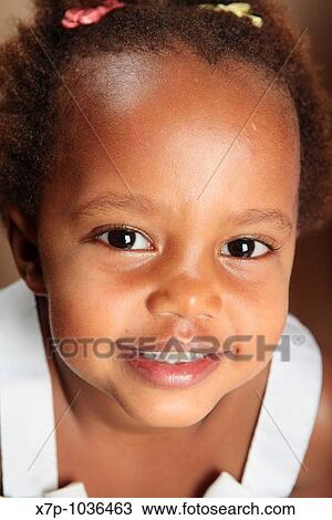 Stock Image - African American girl smiling. Fotosearch