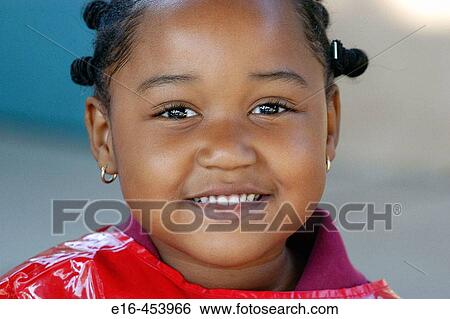 Stock Photograph - African American girl smiling. Fotosearch