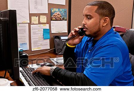 african american man on phone in office making sales calls. View Large Photo Image Stock Photo - african american man on phone in office making sales calls.. Fotosearch