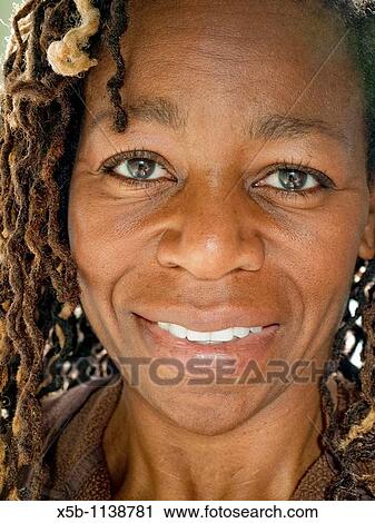 Stock Image - African American woman face smiling. Fotosearch