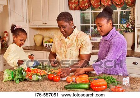 African American woman in kitchen, preparing vegetables with her daughter and granddaughter. View Large Photo Image Stock Image - African American woman in kitchen, preparing vegetables with her daughter and granddaughter.. Fotosearch