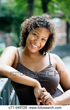 Stock Photo - African-American woman smiling in camera. Fotosearch